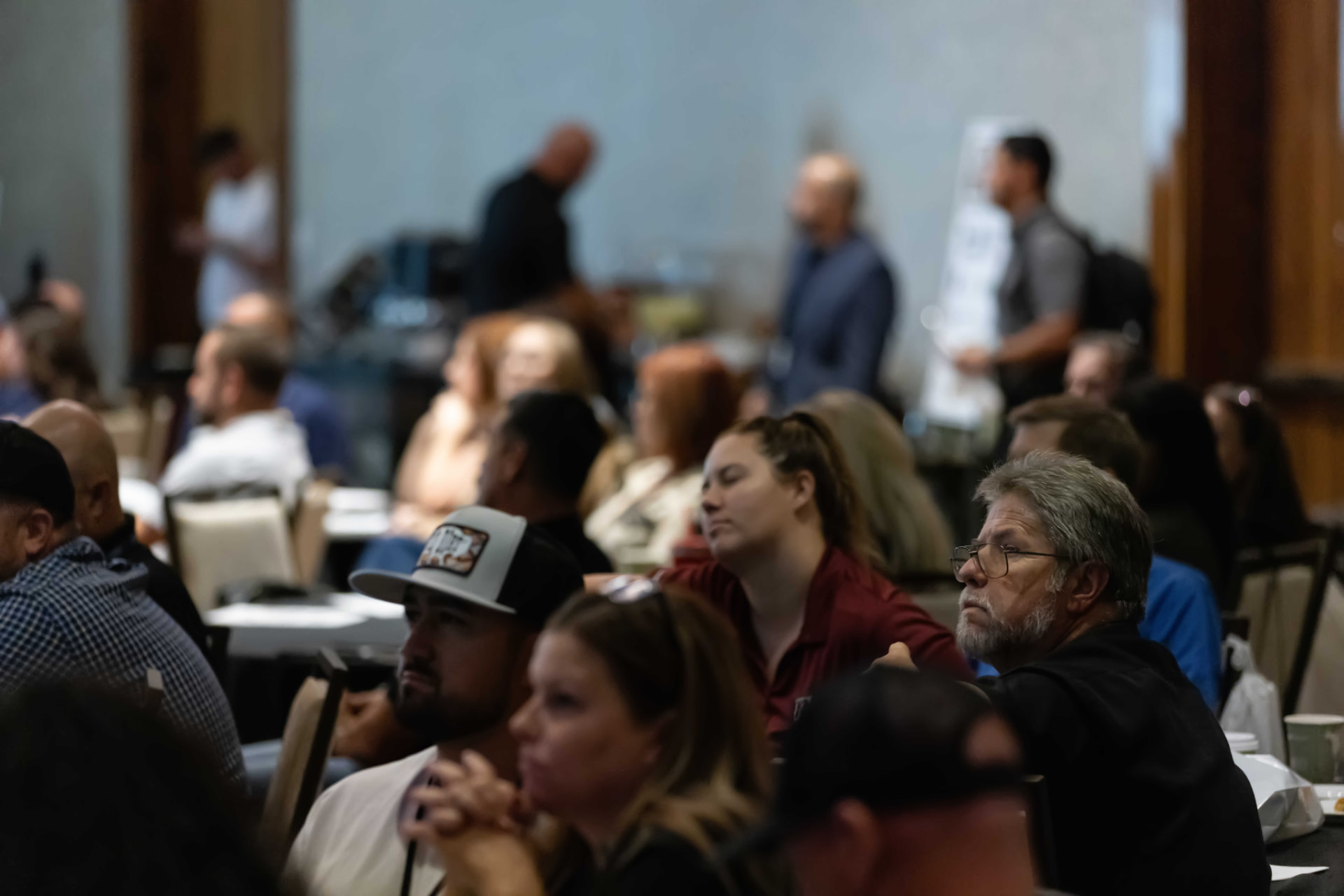 Attendees focused on a Summit presentation