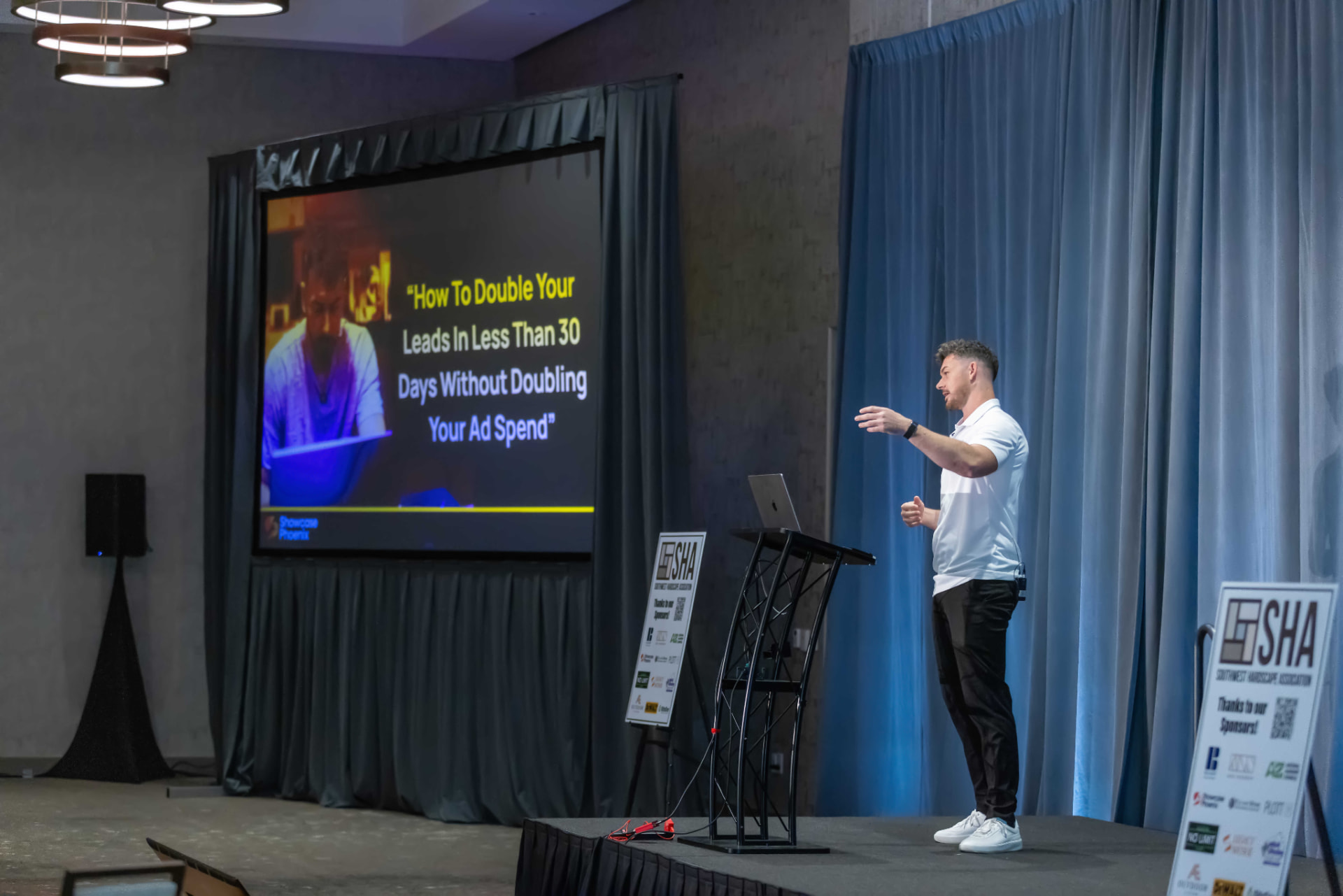 Speaker sharing a presentation from the stage
