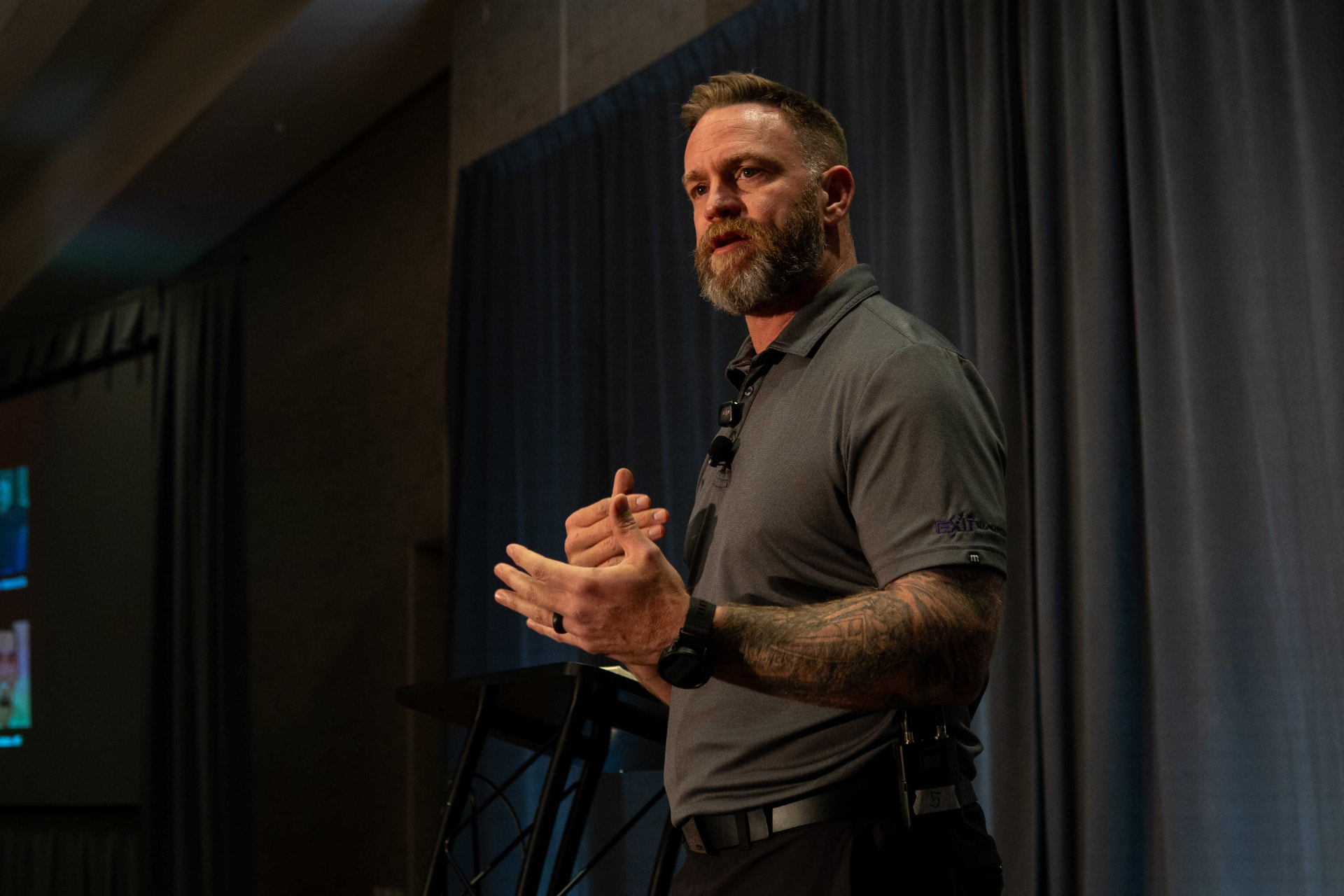 Speaker presenting on stage at last year's Summit