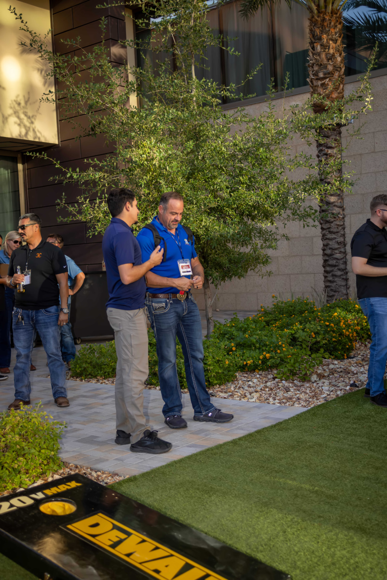 Attendees meeting outdoors after the sessions